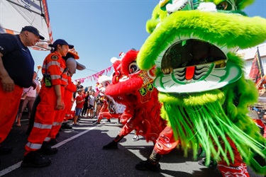 Action shot of dragon dancers in parade