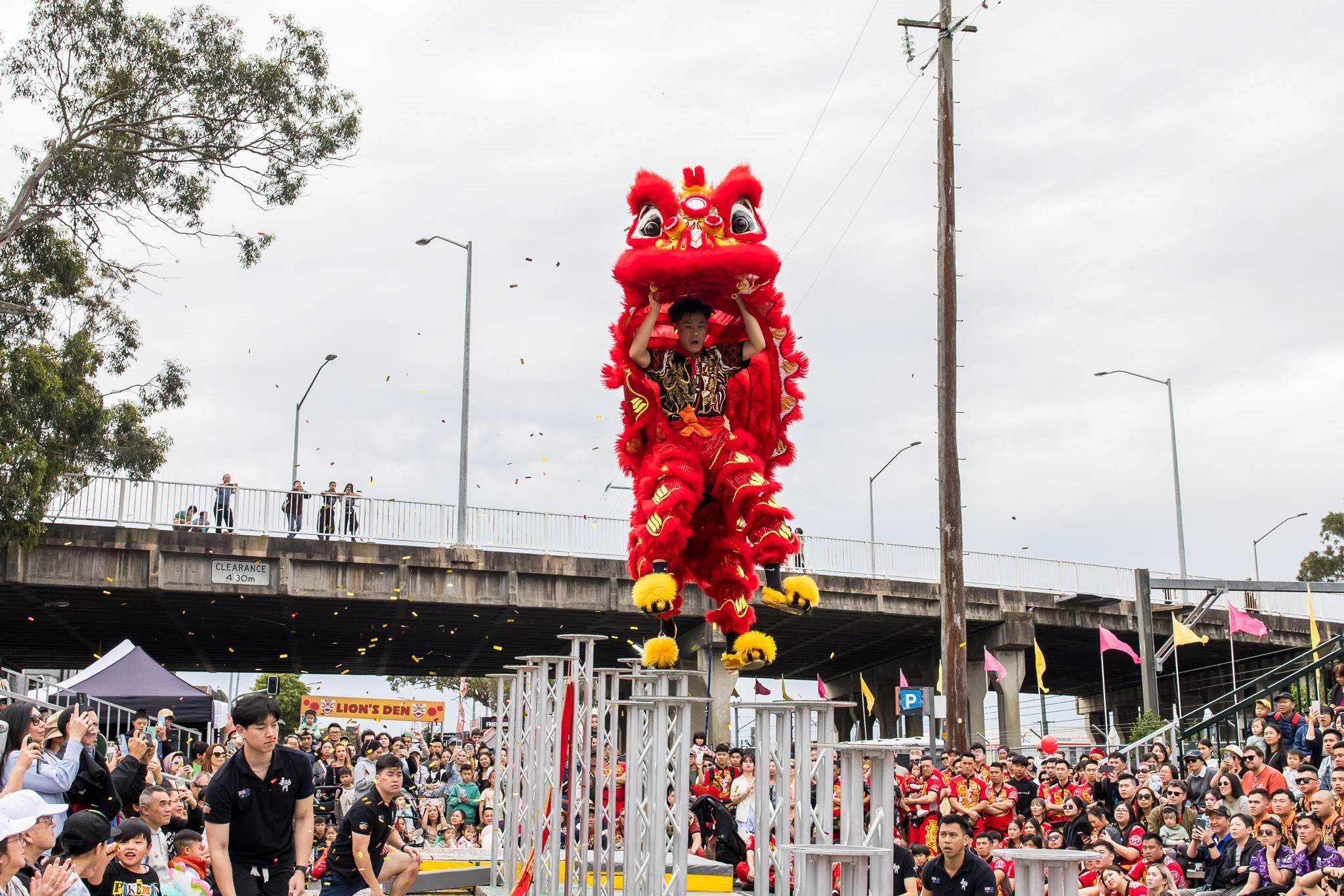 2024 Cabramatta Moon Festival Yung Yee Tong jumping on high poles.