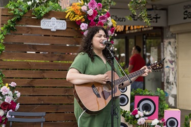 Singer on John Street at 2025 Cabramatta Moon Festival by Anna Kucera.