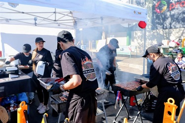 Estradas BBQ team grilling meats.