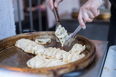 Linlin Potstickers being fried