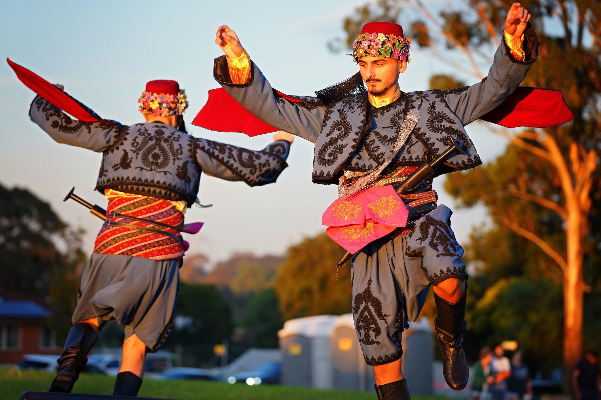 Two Balkan dancers performing in costume