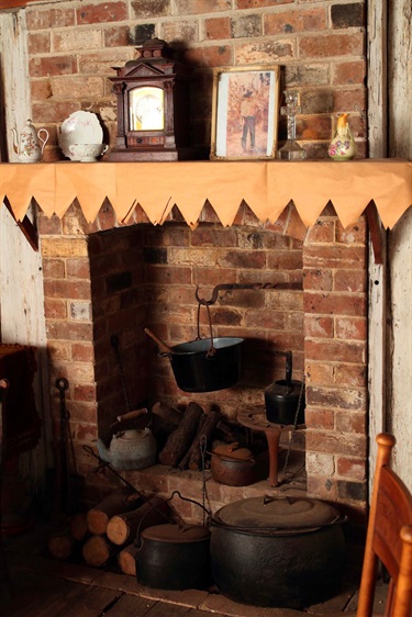 Fire place inside vintage village slab hut