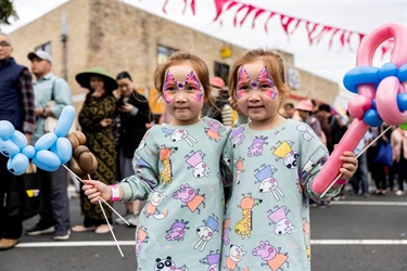 2024 Cabramatta Moon Festival twin sisters with balloons and face painted.
