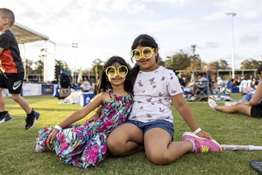 Two young girls with glow glasses
